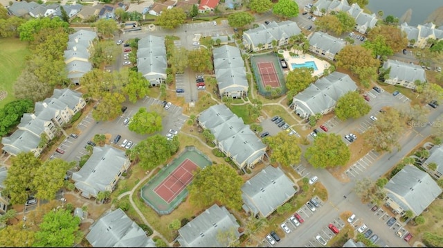birds eye view of property with a residential view