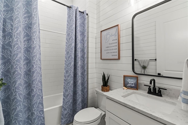 full bath with vanity, shower / bath combo with shower curtain, wooden walls, and toilet