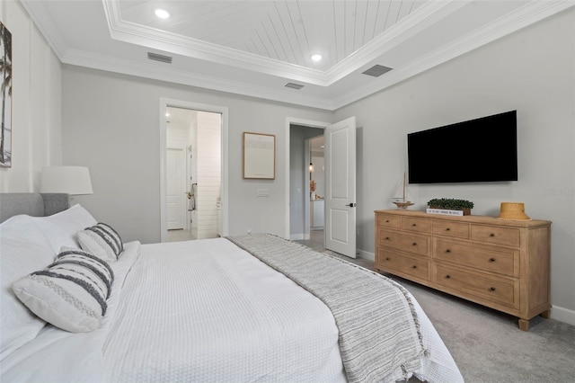 bedroom featuring light colored carpet, visible vents, ornamental molding, and a raised ceiling
