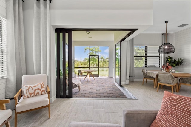 doorway featuring baseboards and visible vents