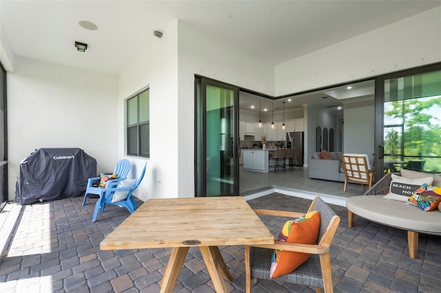 view of patio with a grill