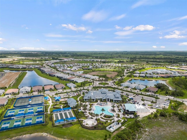bird's eye view featuring a water view and a residential view