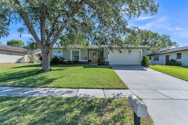 ranch-style home featuring an attached garage, concrete driveway, a front lawn, and stucco siding