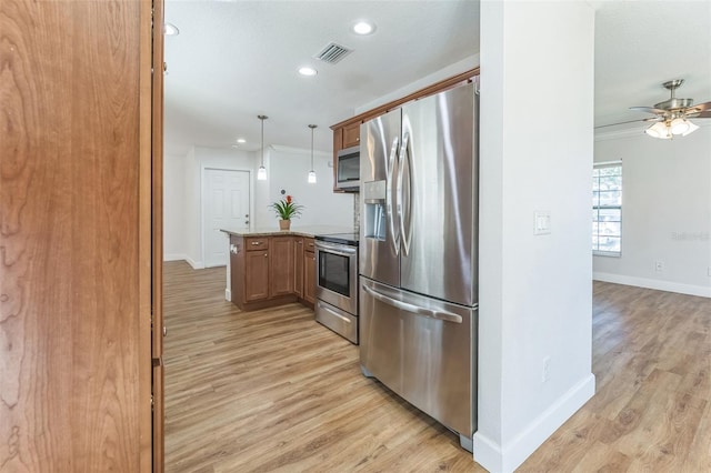 kitchen featuring appliances with stainless steel finishes, a peninsula, light wood-style flooring, baseboards, and recessed lighting