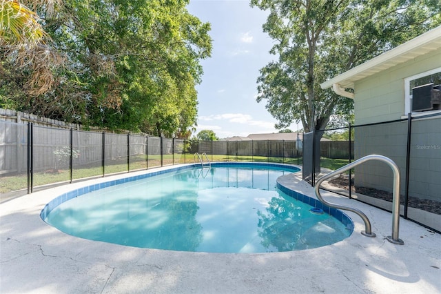 view of pool with a fenced backyard