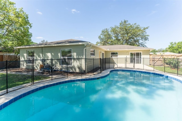 view of swimming pool featuring fence