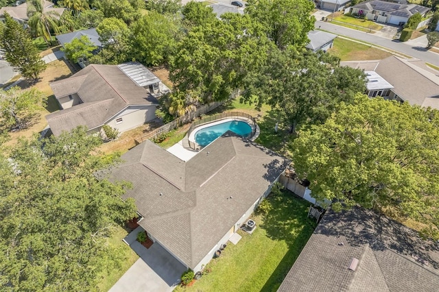 aerial view of residential area featuring a pool