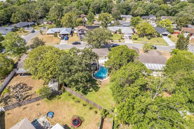 aerial perspective of suburban area featuring a pool