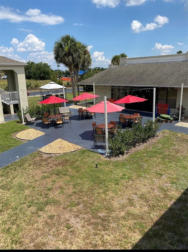5245 W Irlo Bronson Memorial Hwy Unit 194, Kissimmee, FL 34746 - view of home's community featuring a lawn and a patio area