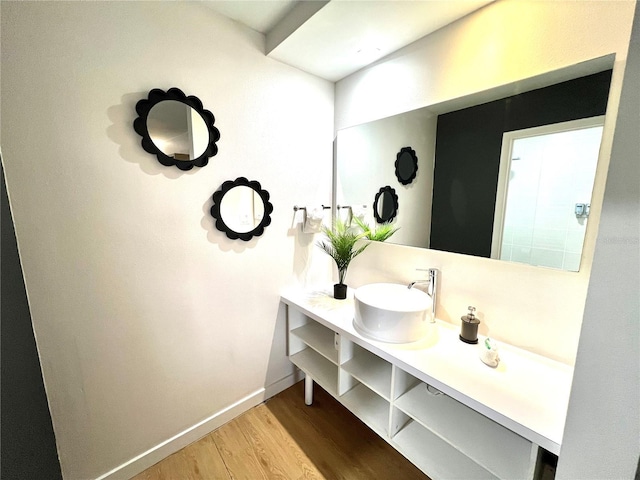 5245 W Irlo Bronson Memorial Hwy Unit 194, Kissimmee, FL 34746 - bathroom with baseboards, wood finished floors, and vanity