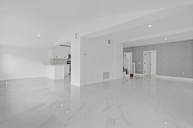 5851 SE Drew Rd, Belleview, FL 34420 - spare room featuring marble finish floor, stairs, recessed lighting, baseboards, and visible vents