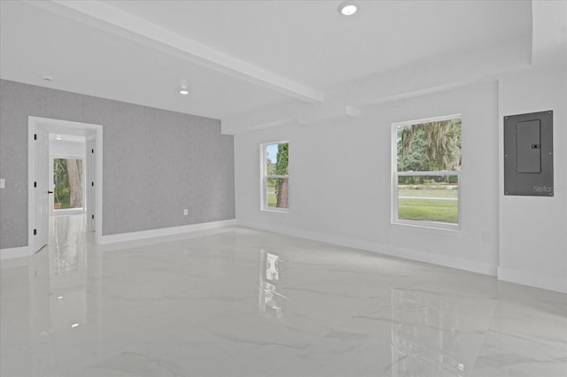 5851 SE Drew Rd, Belleview, FL 34420 - empty room featuring baseboards, a wealth of natural light, electric panel, and marble finish floor