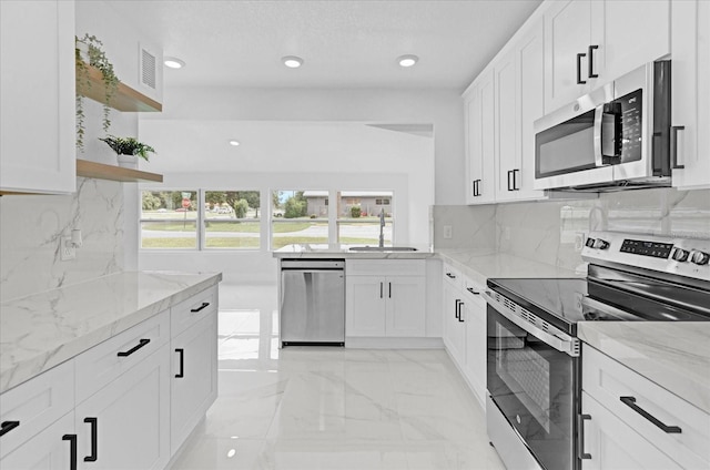 5851 SE Drew Rd, Belleview, FL 34420 - kitchen with open shelves, a sink, light stone counters, marble finish floor, and stainless steel appliances
