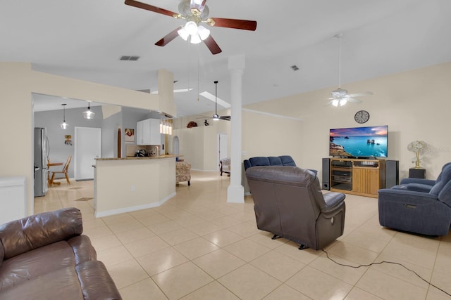 2398 Queenswood Cir, Kissimmee, FL 34743 - living area featuring a ceiling fan, light tile patterned flooring, and lofted ceiling