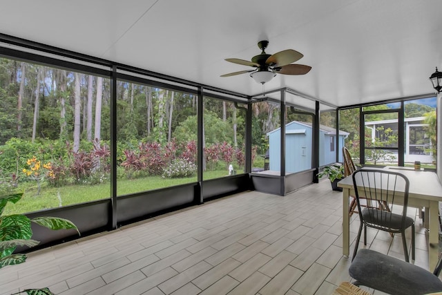 2398 Queenswood Cir, Kissimmee, FL 34743 - unfurnished sunroom with a ceiling fan and plenty of natural light