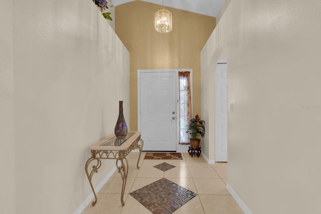 2398 Queenswood Cir, Kissimmee, FL 34743 - entryway featuring a chandelier, light tile patterned floors, and a high ceiling