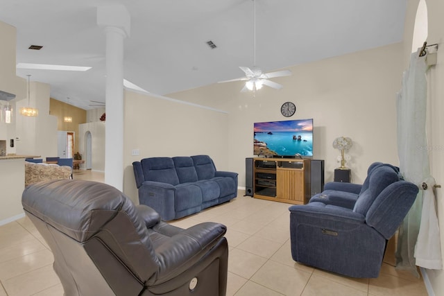 2398 Queenswood Cir, Kissimmee, FL 34743 - living area featuring light tile patterned flooring, ceiling fan, and high vaulted ceiling