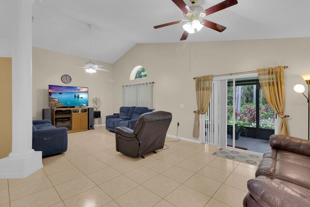 2398 Queenswood Cir, Kissimmee, FL 34743 - living room with a ceiling fan, light tile patterned flooring, and high vaulted ceiling