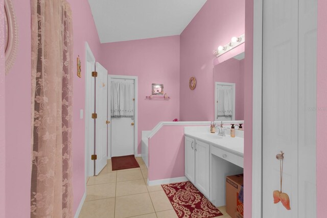 2398 Queenswood Cir, Kissimmee, FL 34743 - full bath with vanity, tile patterned floors, a garden tub, and a closet