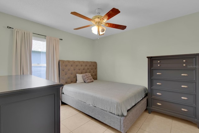 2398 Queenswood Cir, Kissimmee, FL 34743 - bedroom featuring light tile patterned flooring and a ceiling fan