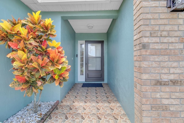 2398 Queenswood Cir, Kissimmee, FL 34743 - property entrance with stucco siding