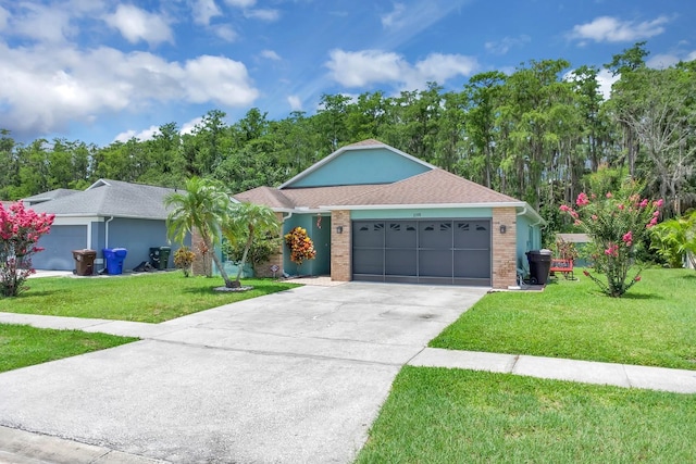 2398 Queenswood Cir, Kissimmee, FL 34743 - single story home featuring a front yard, an attached garage, concrete driveway, and brick siding