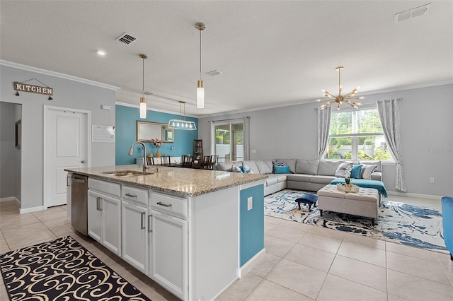 3084 Slough Creek Dr, Kissimmee, FL 34744 - kitchen featuring a sink, crown molding, a chandelier, light tile patterned floors, and stainless steel dishwasher