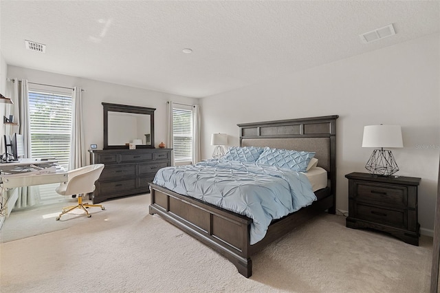 3084 Slough Creek Dr, Kissimmee, FL 34744 - bedroom featuring light carpet, multiple windows, and a textured ceiling