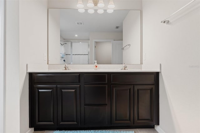 3084 Slough Creek Dr, Kissimmee, FL 34744 - bathroom with a shower stall, double vanity, and baseboards