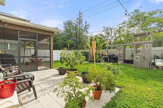 3084 Slough Creek Dr, Kissimmee, FL 34744 - view of yard with a sunroom and a patio