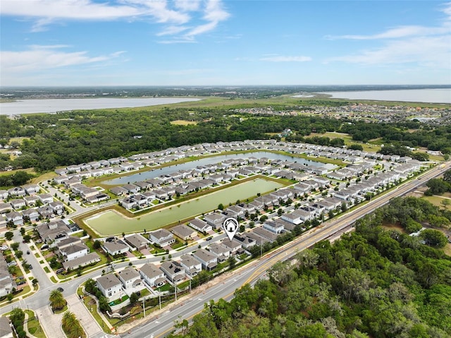 3084 Slough Creek Dr, Kissimmee, FL 34744 - aerial view of property and surrounding area featuring nearby suburban area and a large body of water