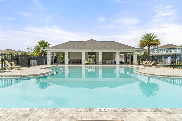 3084 Slough Creek Dr, Kissimmee, FL 34744 - community pool with fence and a patio