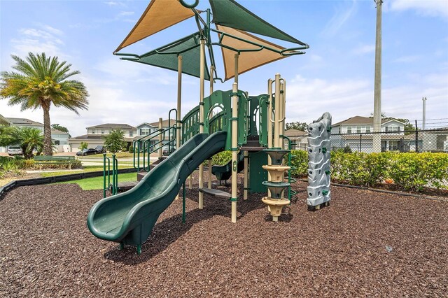 3084 Slough Creek Dr, Kissimmee, FL 34744 - community jungle gym featuring fence and a residential view