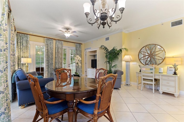 dining room with light tile patterned floors, a chandelier, baseboards, crown molding, and a ceiling fan