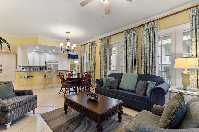 living room with light tile patterned floors, a chandelier, crown molding, a ceiling fan, and french doors