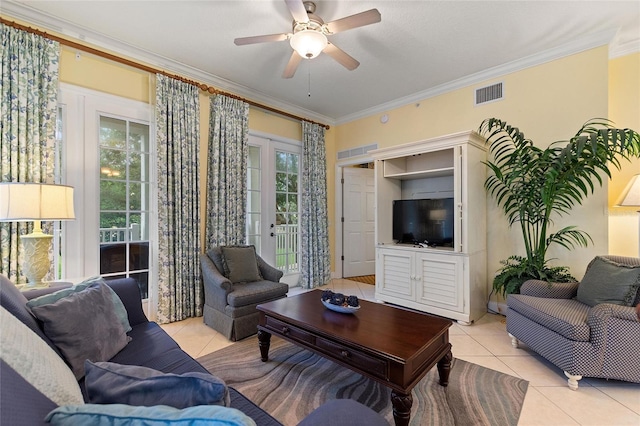 living room featuring light tile patterned floors, ornamental molding, ceiling fan, and french doors