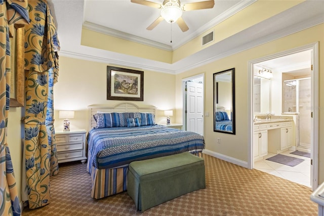 bedroom featuring carpet, ornamental molding, a sink, a ceiling fan, and connected bathroom