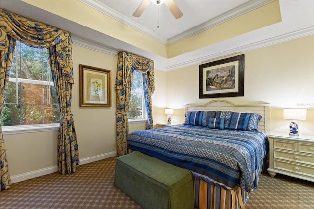 carpeted bedroom with multiple windows, ornamental molding, baseboards, and a ceiling fan