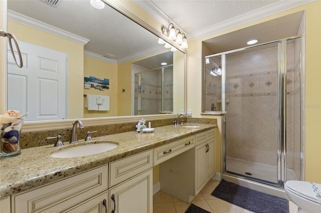 full bathroom with tile patterned floors, a shower stall, double vanity, ornamental molding, and a textured ceiling