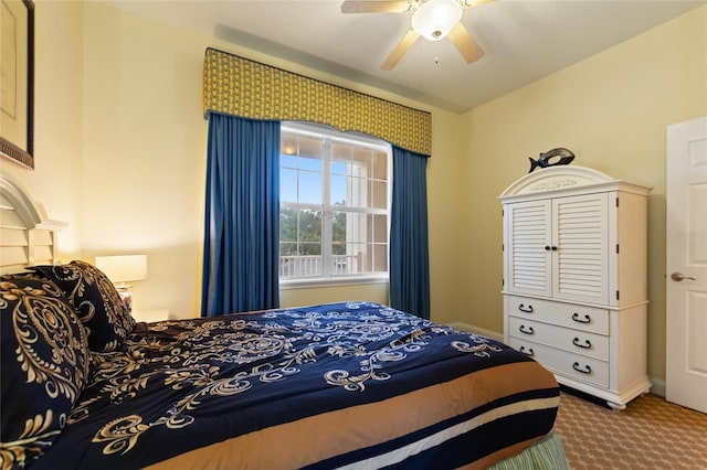 bedroom featuring carpet flooring, a ceiling fan, and baseboards