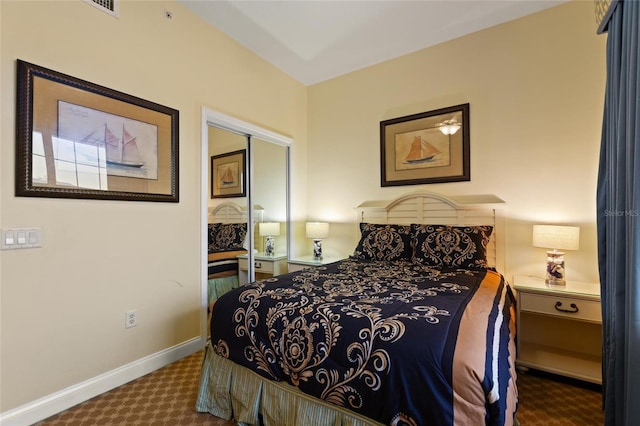 bedroom featuring carpet flooring and baseboards