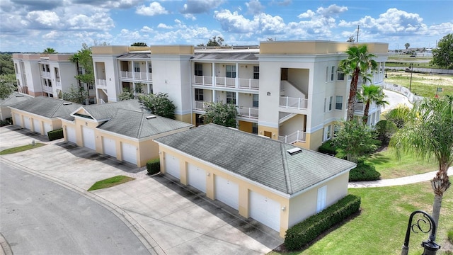 view of property featuring community garages and a residential view