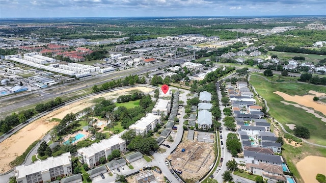 aerial overview of property's location featuring a golf course