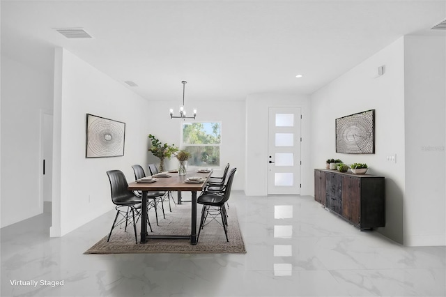 dining room with light marble finish floors, a chandelier, and recessed lighting