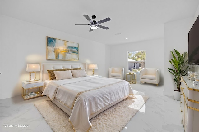 bedroom featuring marble look tile flooring and a ceiling fan