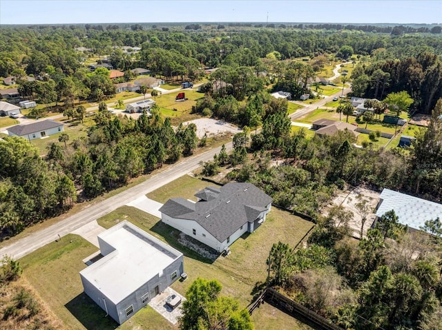 aerial perspective of suburban area with a forest