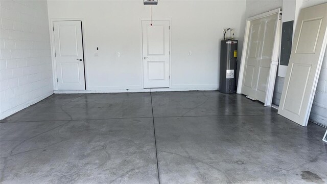 318 Cocoa Ct, Kissimmee, FL 34758 - garage featuring water heater and electric panel