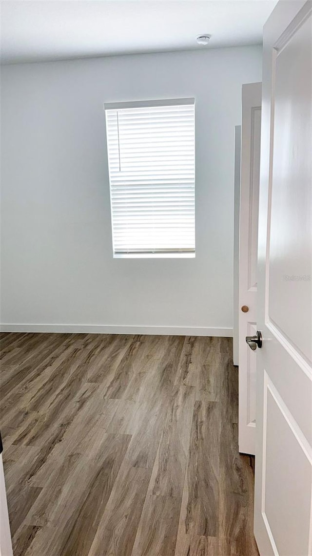 318 Cocoa Ct, Kissimmee, FL 34758 - unfurnished room featuring wood finished floors and baseboards