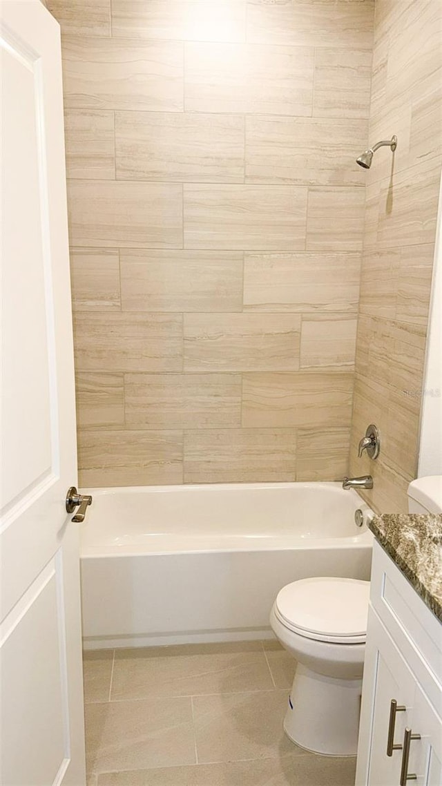 318 Cocoa Ct, Kissimmee, FL 34758 - full bathroom with washtub / shower combination, toilet, tile patterned floors, and vanity
