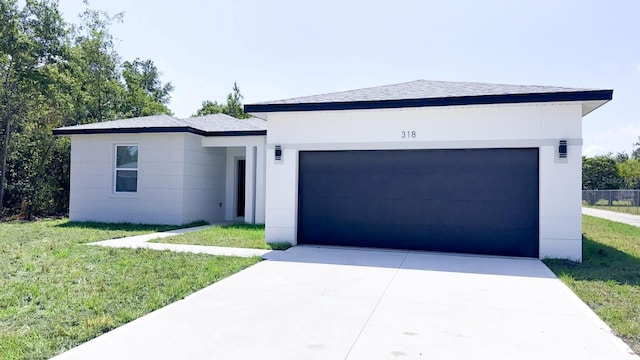 318 Cocoa Ct, Kissimmee, FL 34758 - view of front facade featuring a garage, a front yard, and concrete driveway